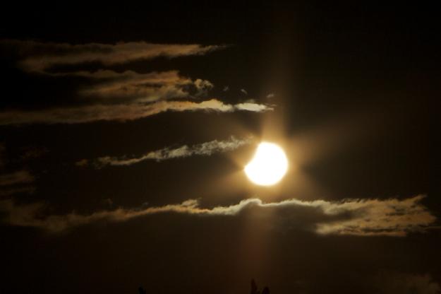 Partial solar eclipse (Nov 25 2011) from Dunedin, New Zealand. Photographed before it peaked as the clouds rolled in and blocked it from being visible at peak. Credit: Bonar Carson | Spaceweather.com