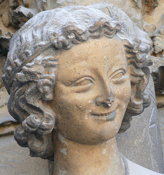 562px-Laughing_angel_Reims